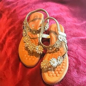 Never worn NWOT.  Flower Sandals